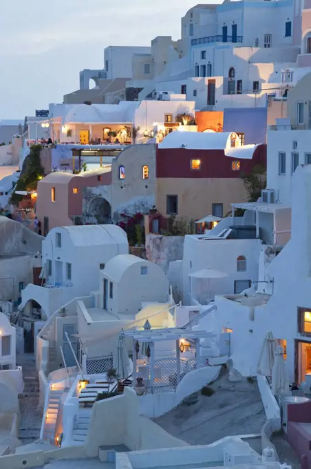 High angle view of traditional white washed houses on a Greek Island at dusk.