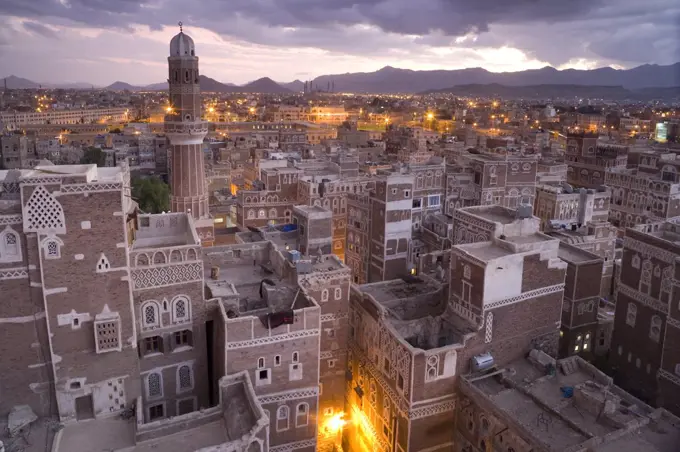 High angle view over rooftops of buildings in the old city of Sana'a in Yemen. A UNESCO world heritage site with traditional architecture, houses of many storeys with decorative friezes.