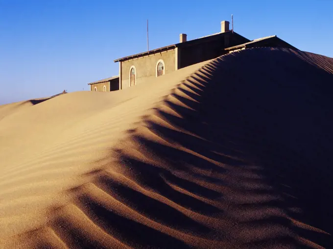 House Buried in Sand