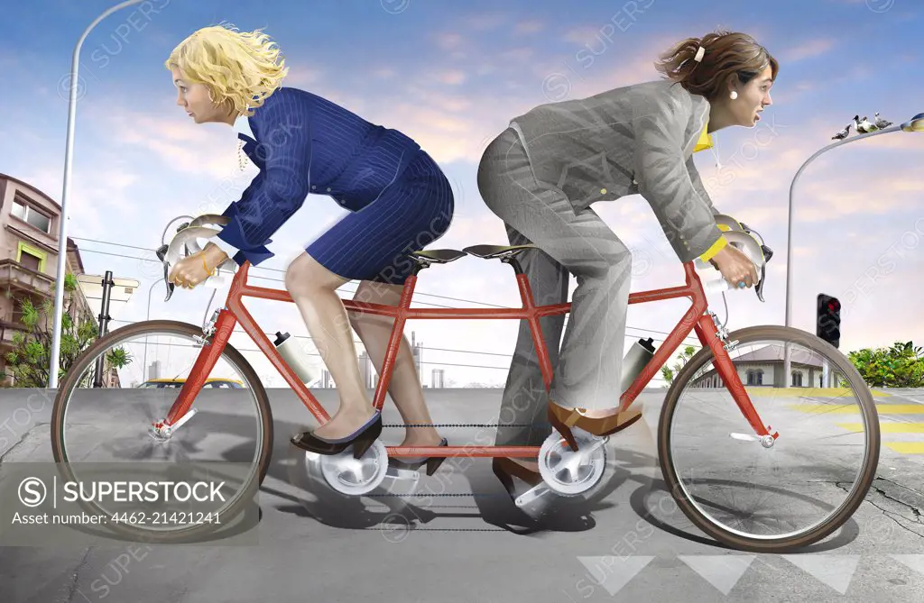 Businesswomen cycling in different directions