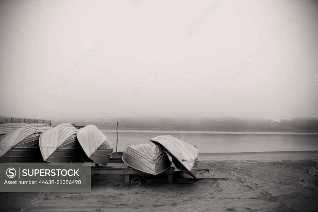 View of few boats kept on seashore.