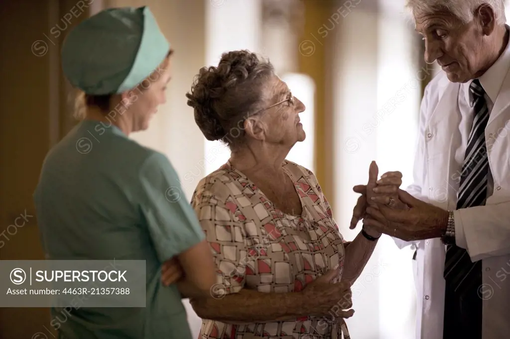 View of a doctor checking up an elderly woman.