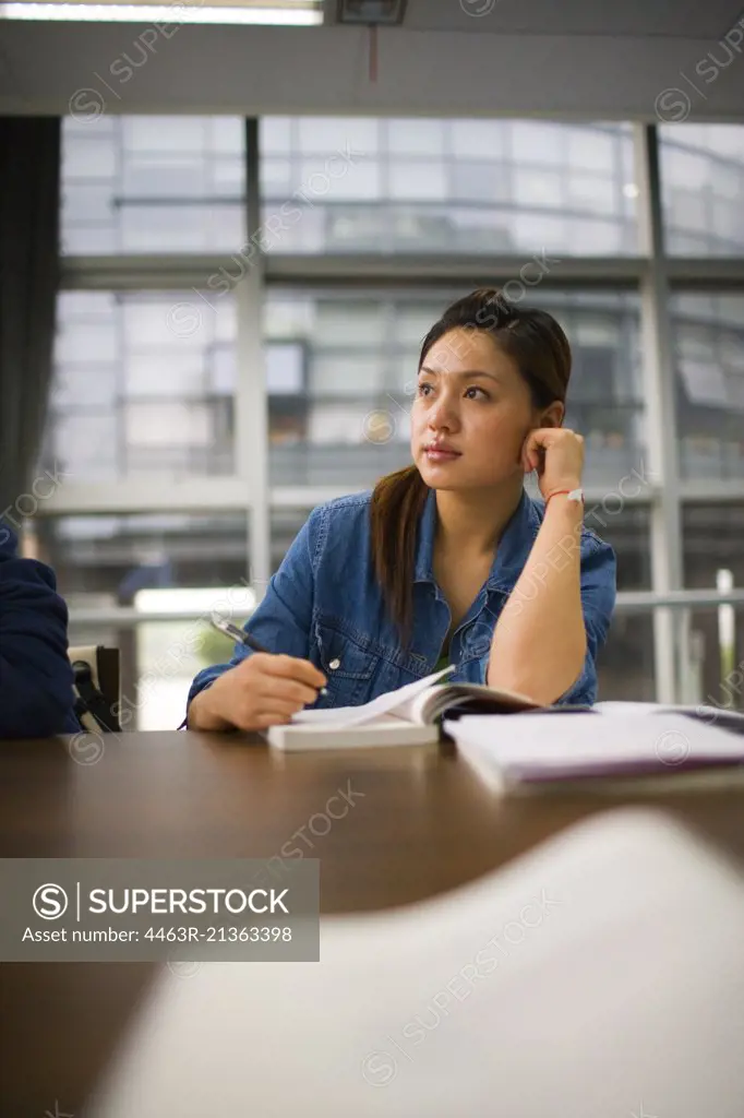 Teenage girl sitting in a classroom.