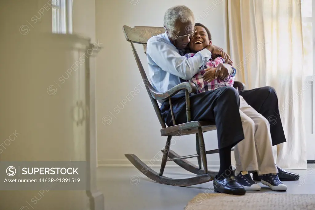 Happy senior man spending time with his middle aged son.