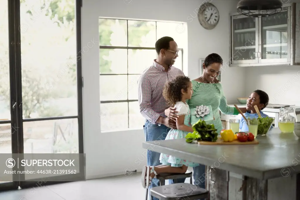 Family making salad together.