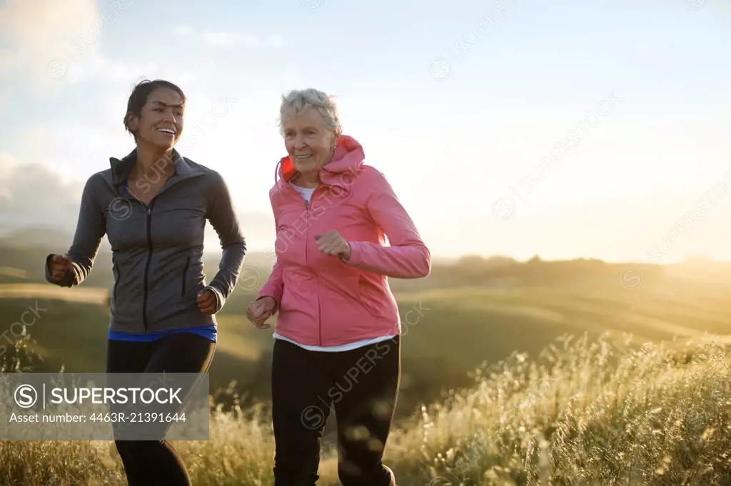 Happy mature couple admire the view after exercising outdoors.