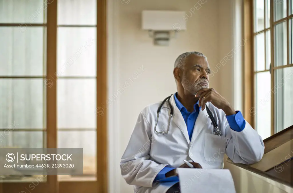 Doctor sitting and looking out the window