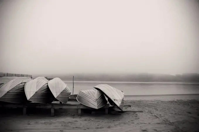 View of few boats kept on seashore.