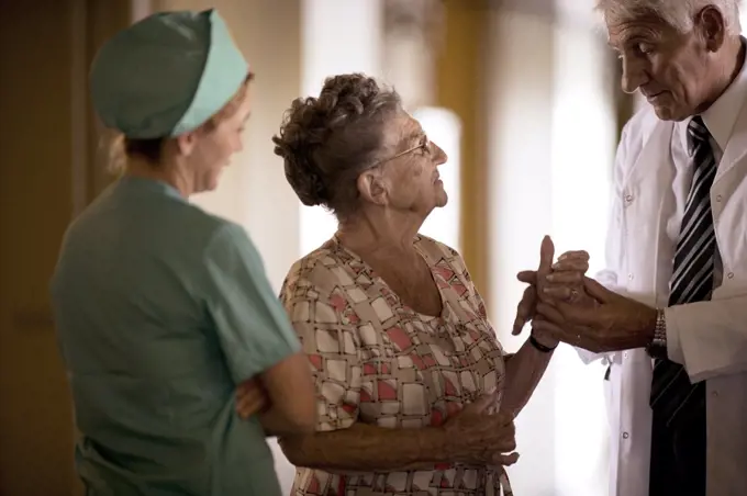 View of a doctor checking up an elderly woman.