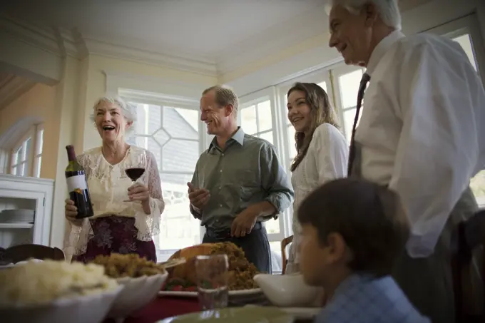 Happy family enjoying a meal together on Christmas Day.