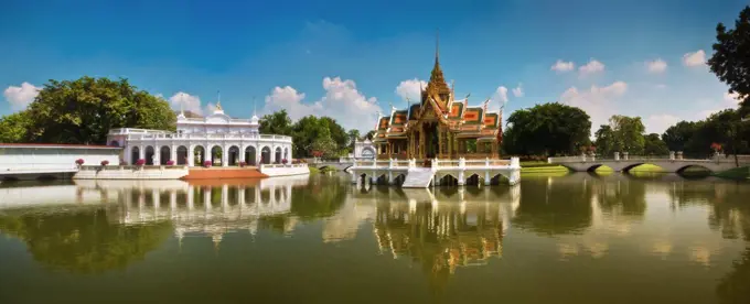 Wide angle view of temple and pond.