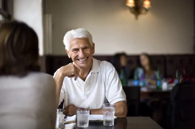 Senior couple relaxing at a cafe.