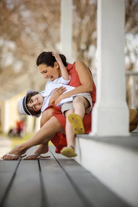 Mother and son sitting and playing