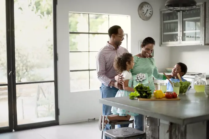 Family making salad together.