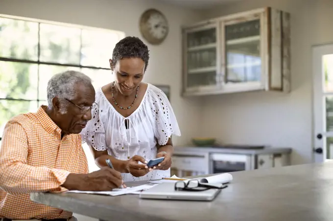 Husband and wife do taxes together.