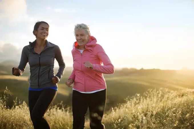 Happy mature couple admire the view after exercising outdoors.