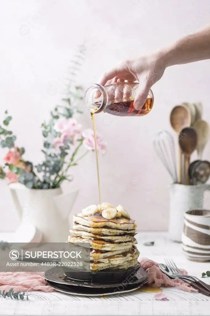 Vegan Banana Pancakes topped with Maple Syrup.