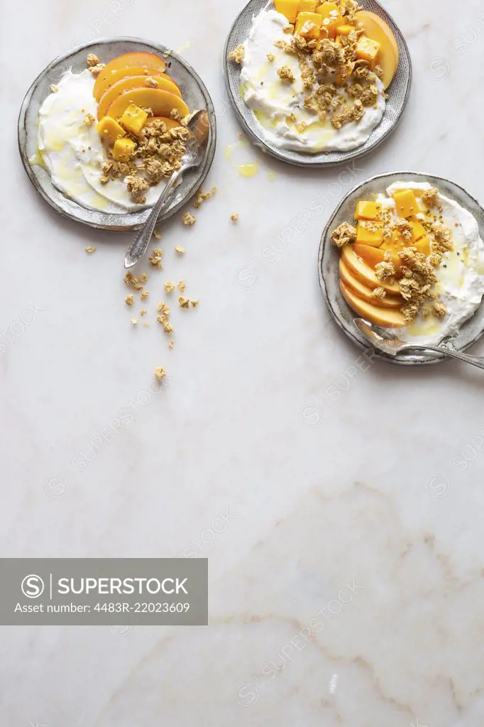 Gluten free breakfast to go - Greek yogurt, peach, mango and granola with honey and bee pollen.