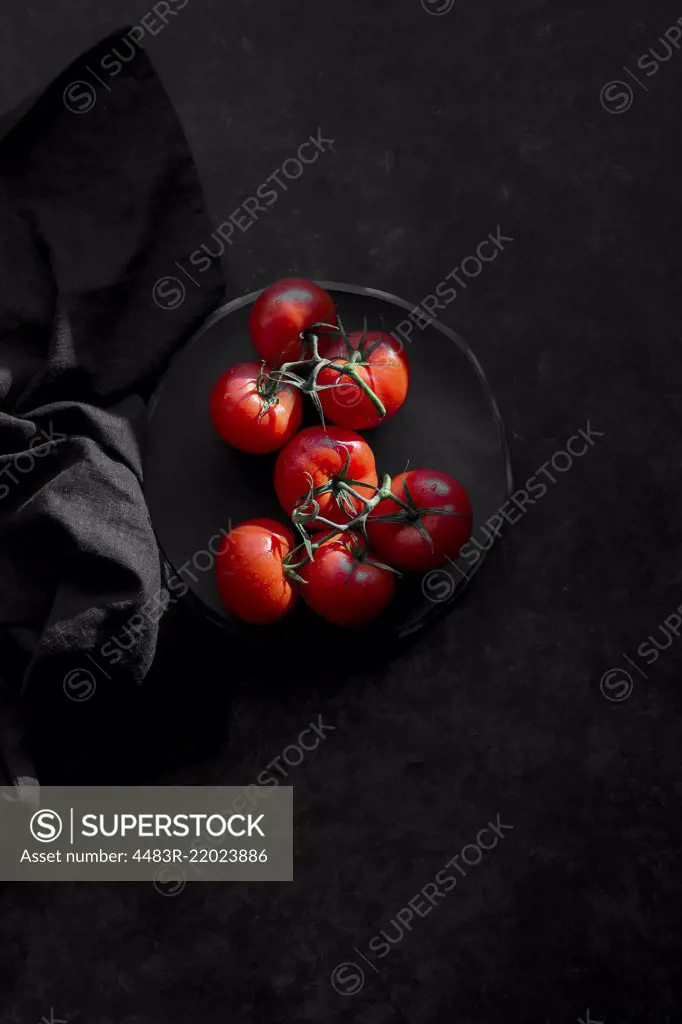 Tomatoes on a black background