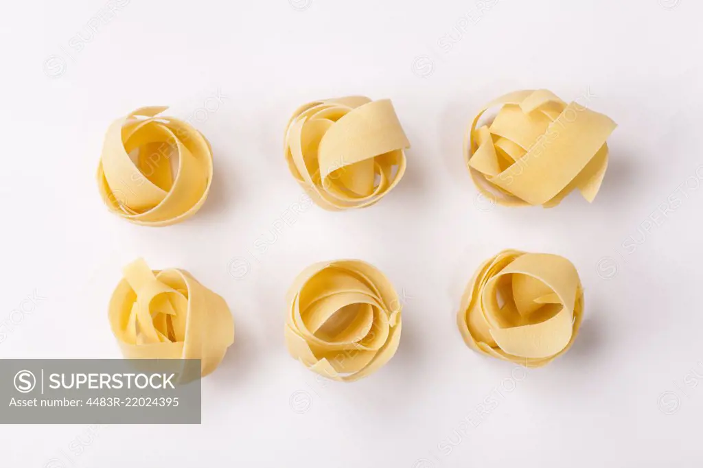 Spilled raw pappardelle pasta