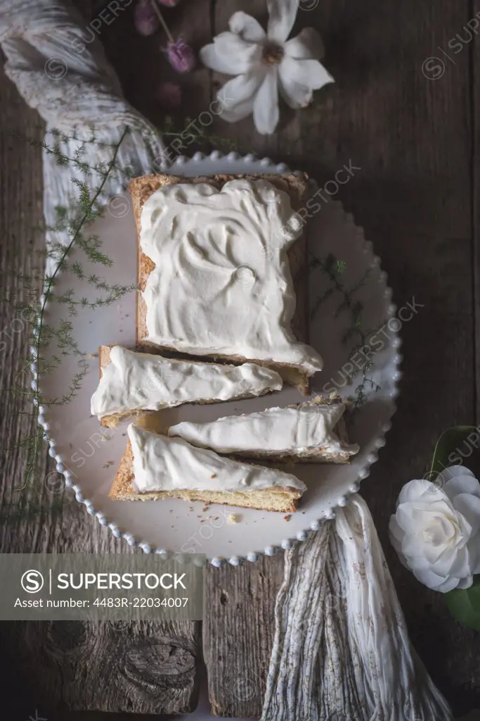 A sponge cake on a rustic kitchen table