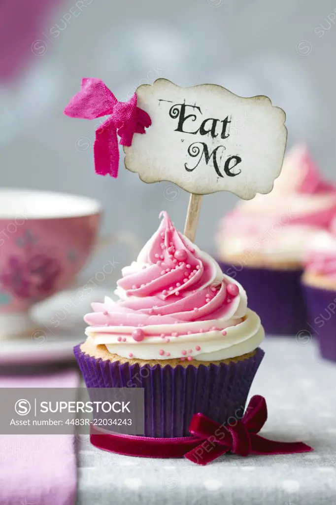 Cupcake with "Eat Me" pick