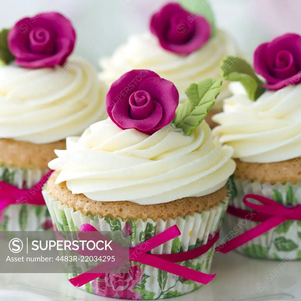 Cupcakes decorated with pink sugar roses