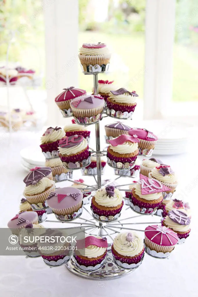 Cupcake stand filled with cupcakes for a 40th birthday party