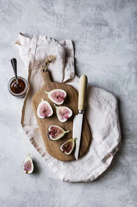 Sliced fresh figs on a chopping board