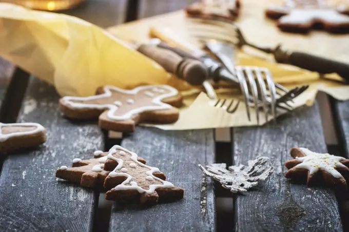 Christmas cookies on old wooden table with vintage cutlery