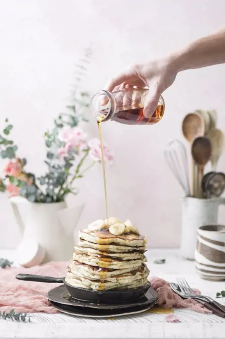 Vegan Banana Pancakes topped with Maple Syrup.