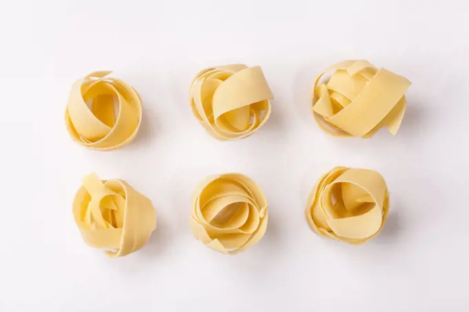 Spilled raw pappardelle pasta