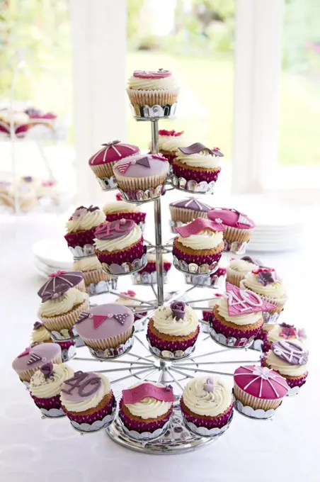 Cupcake stand filled with cupcakes for a 40th birthday party