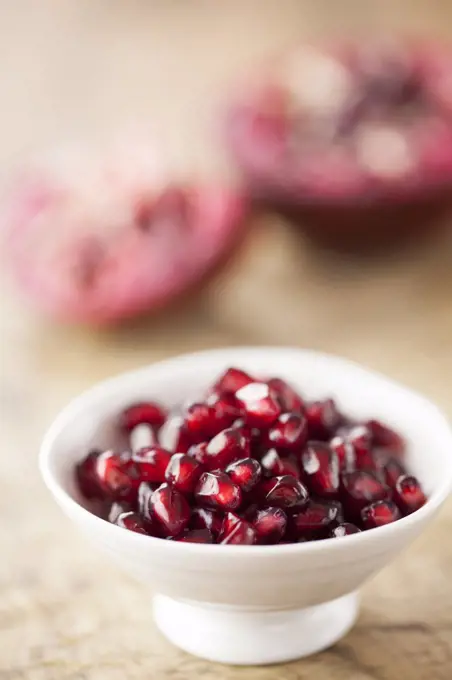 Pomegranate Seeds in White Bowl