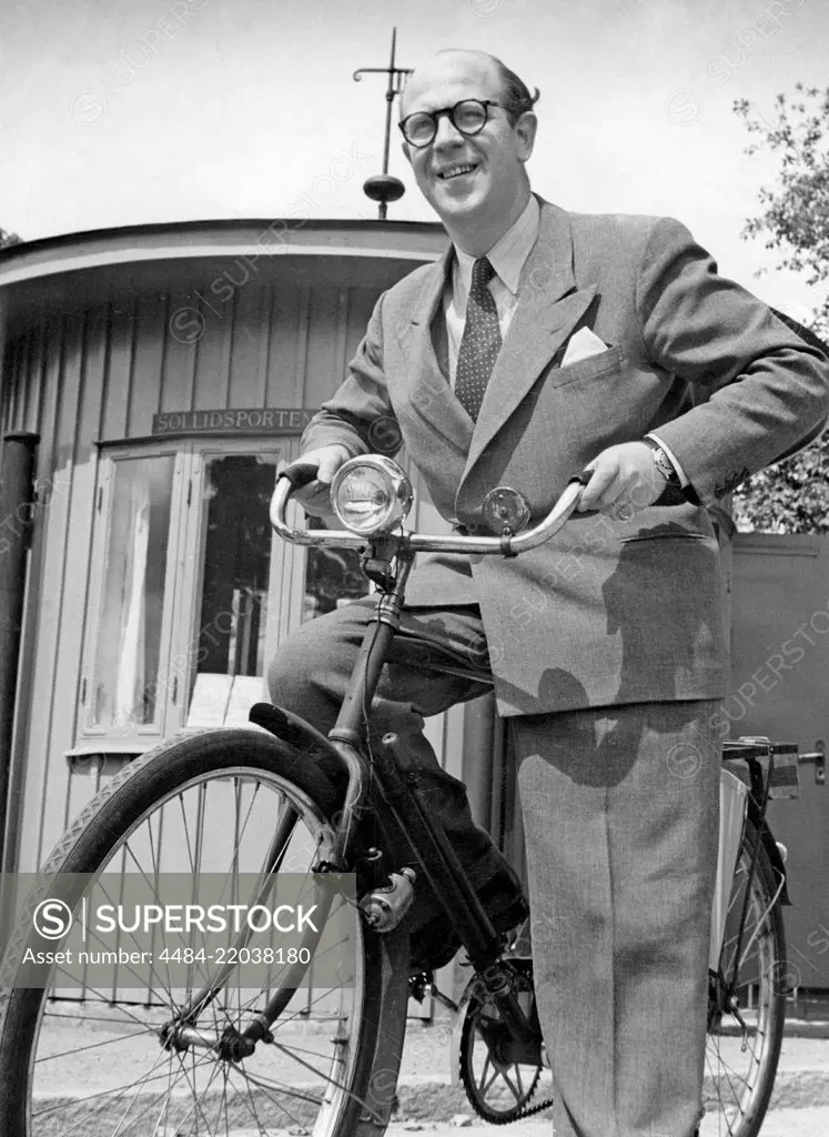 1940s man on his bicycle. Composer Thore Ehrling on Skansen museum with his bicycle. Sweden 1948