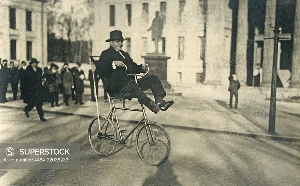 1920s man on a bicycle. The Swedish bicycle acrobat Fritiof Malmsten is performing his tricks on his special bicycle on Karl Johans square in Oslo. The bicycle model was called the swing bicycle and was an unusual invention with an extraordinary construction to perform balance acts and other tricks.