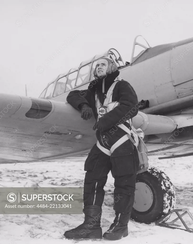 Pilot in the 1950s. A swedish pilot beside his aircraft a winter day. Sweden 1950s