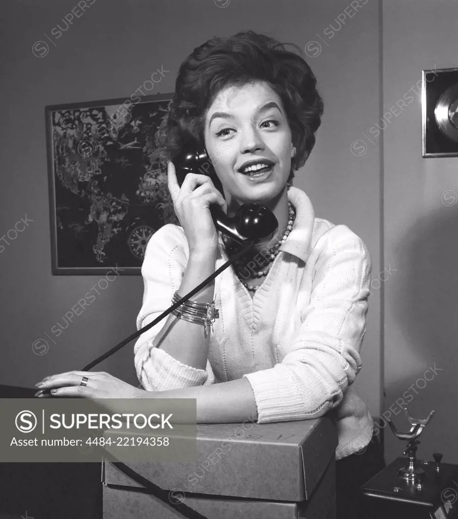 Woman in the 1950s. A young dark-haired woman speaking on the phone. She is the swedish singer Lill-Babs Svensson. 1938-2018. Ref 11-01-9