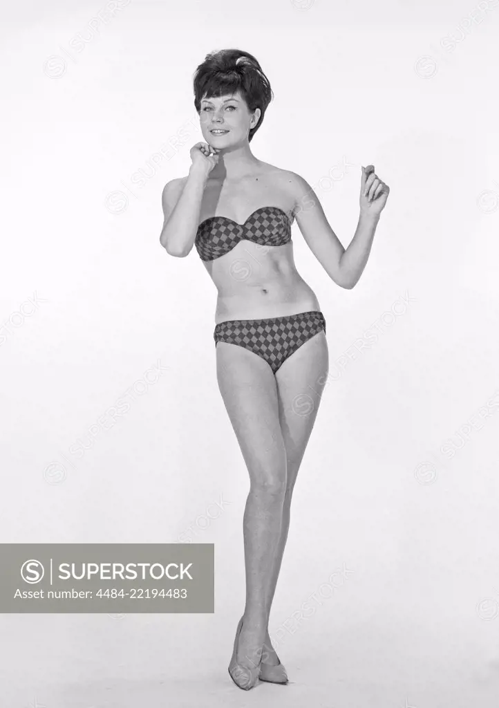 1960s bikini fashion. A blonde girl in a photographers studio in a typical 1960s bikini. Sweden 1960s Photo Kristoffersson ref CP25-5