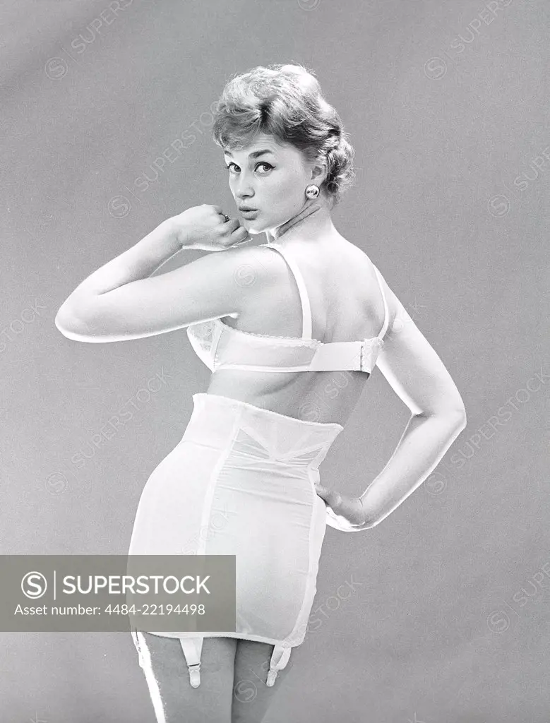 1950`s Woman in Girdle and Stockings Stock Image - Image of