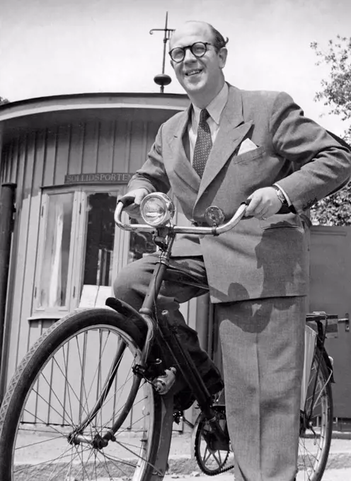 1940s man on his bicycle. Composer Thore Ehrling on Skansen museum with his bicycle. Sweden 1948