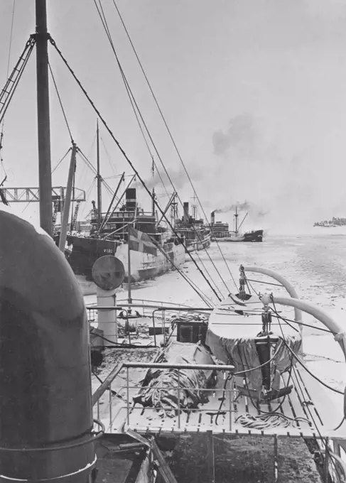 Winter at sea in the 1940s. Pictured the swedish icebreaker Atle in the Baltic sea with a convoy of ships following it in the channel of water created through the ice by the icebreaker. The winter of 1942 was one of the coldest in Scandinavia. Sweden 1942 