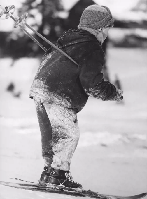 Winter in the 1960s. A boy is skiing. By the looks of the snow on his clothes, he has fallen many times. Sweden 1960s