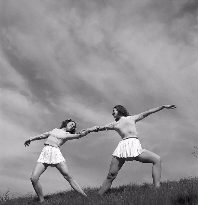 Gymnasts in the 1940s. Lalla Cassels dance troup. Two of the girls are training and poses in a dance on a summer's day. Sweden Photo Kristoffersson Ref N145. Sweden 1945