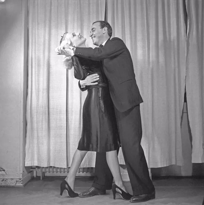 Dancing in the 1940s. A dancing couple in the 1940s. The elegant couple are training their dance steps at a dance school. Photo Kristoffersson Ref B3-4. Sweden 1943