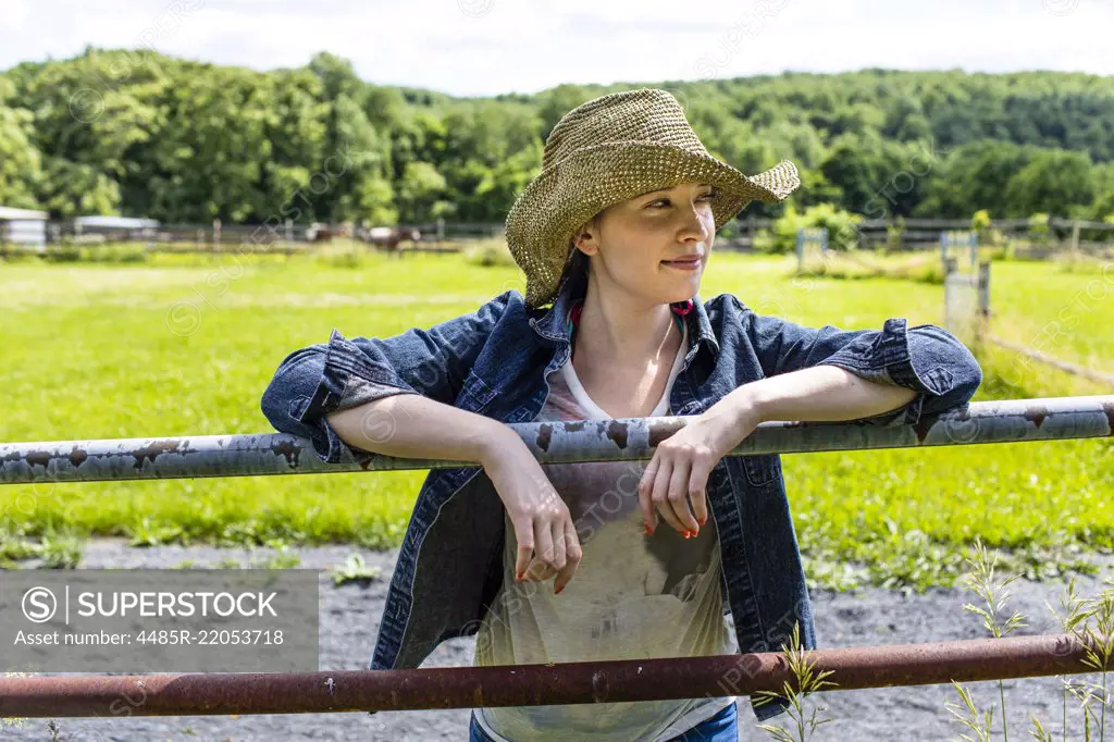 A Young Female farmer On A Pennsylvania Horse Farm