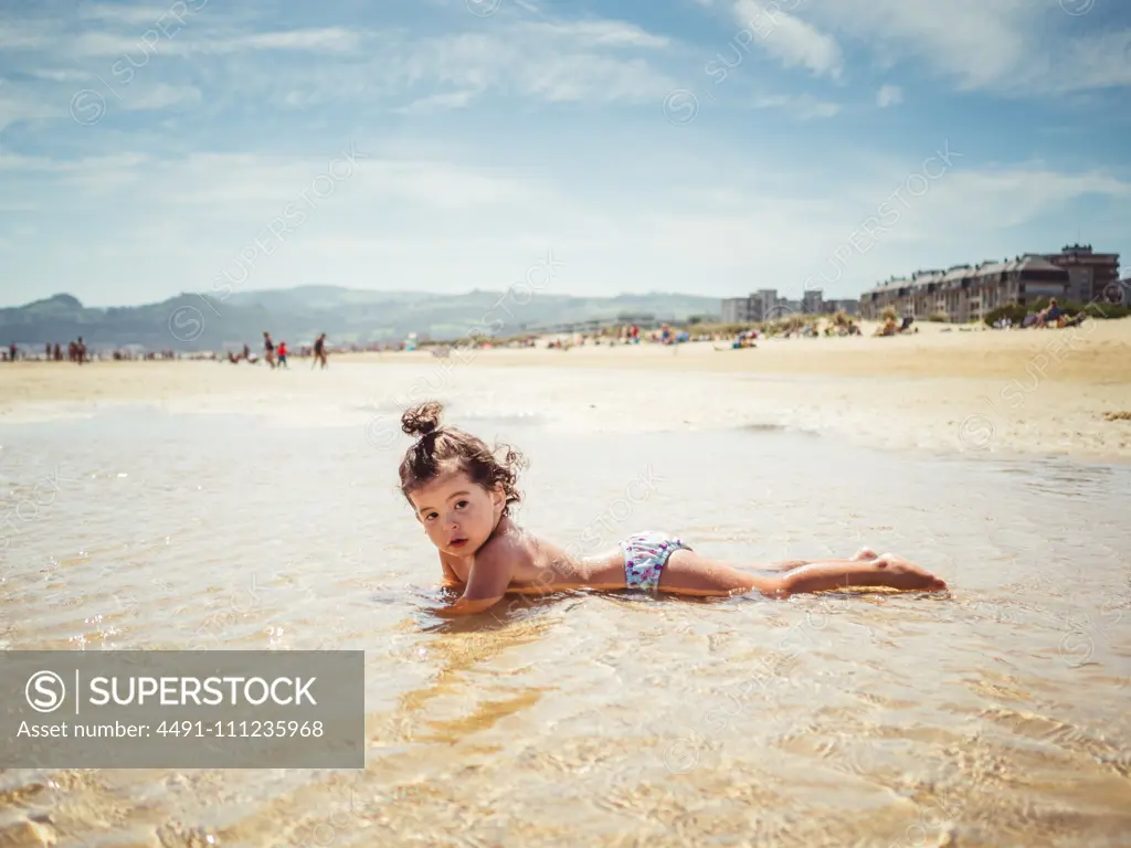 little girl by the seashore