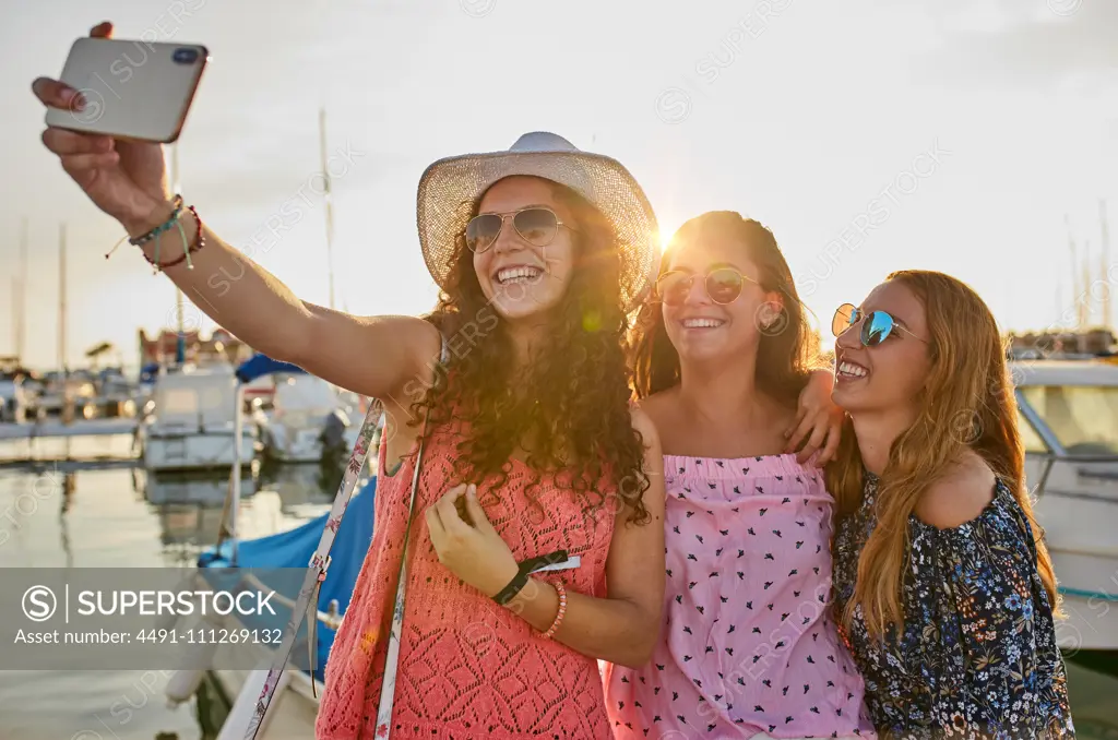 Optimistic fellows bonding and shooting selfie in summer