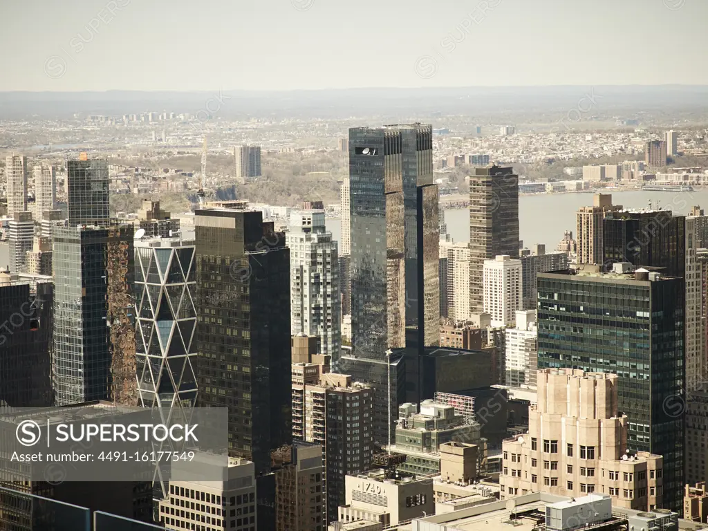 Aerial view of modern New York city district with glass high rise towers in sunlight