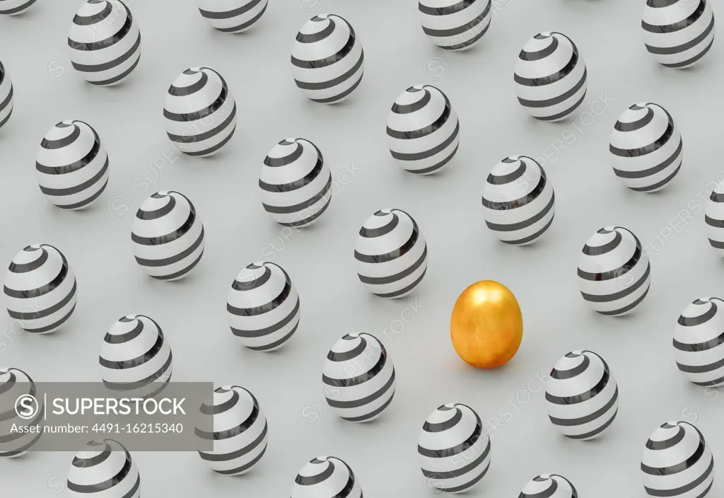 Golden egg on a background of painted eggs for Easter